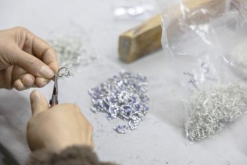 10 Rhinestone charms being assembled to make a tiara