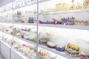 23 Shelves full of tiaras crowns and other festive headwear